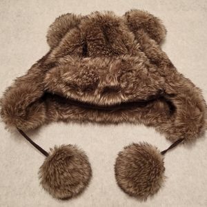 Faux fur lined winter hat with pom pom ties